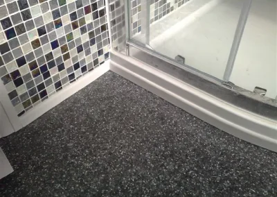 A neat and tidy finish to this shower room makeover. Most modern day vinyl is anti-slip.
